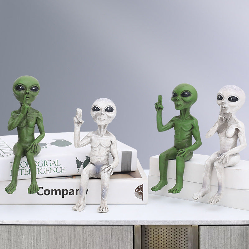 Three Wise Alien Statues