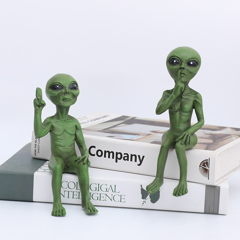 Three Wise Alien Statues